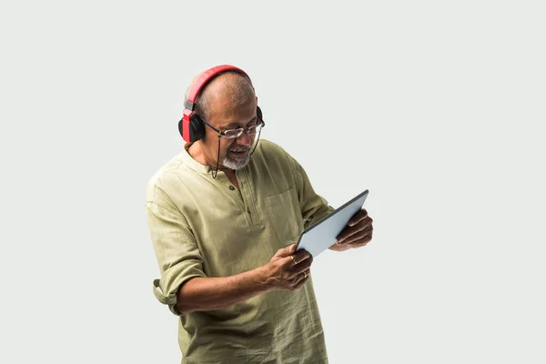 Happy Senior Indian Asian Bearded Man Smiling Using Headphones Smartphone — Stock Photo, Image