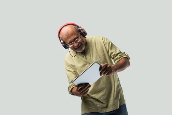 Happy Senior Indian Asian Bearded Man Smiling Using Headphones Smartphone — Stock Photo, Image