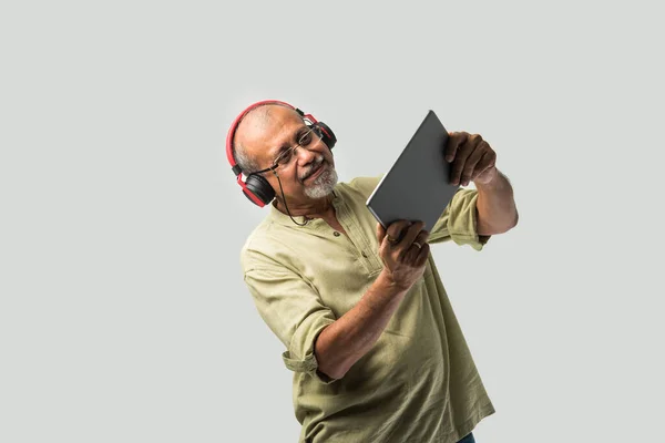 Happy Senior Indian Asian Bearded Man Smiling Using Headphones Smartphone — Stock Photo, Image