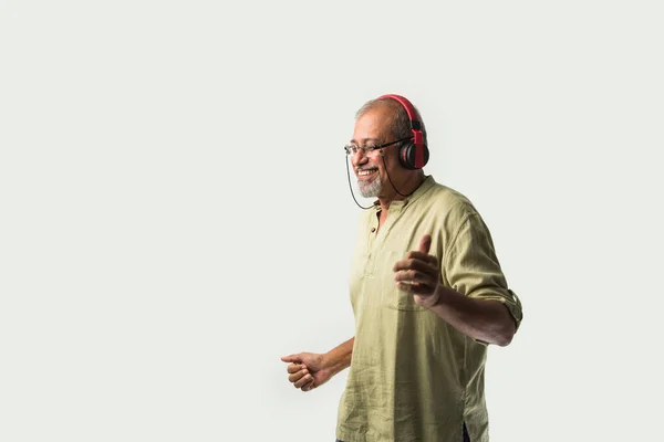 Happy Senior Indian Asian Bearded Man Smiling Using Headphones Smartphone — Stock Photo, Image