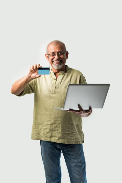 Senior Iasian Indian Adult Holding Laptop Credit Card Online Shopping — Stock Photo, Image
