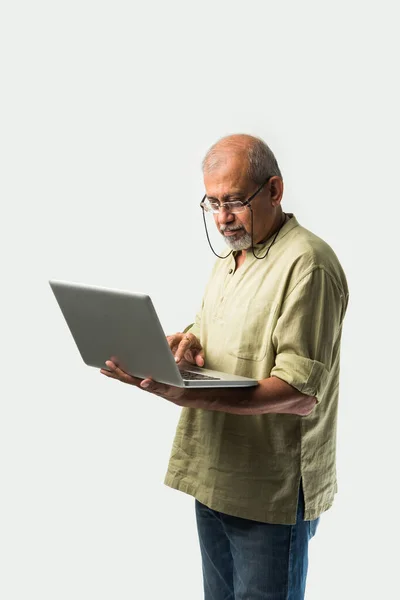 Indian Asian Senior Adult Man Grandpa Using Laptop Holding Paper — Stock Photo, Image