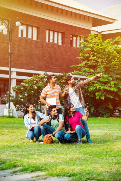 Cheerful Group Indian Asian College Students Pointing Blank While Standing — Stock Photo, Image