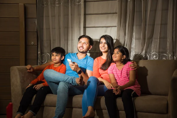 Indian Asian Family Four Watching Television While Sitting Sofa Couch — Stock Photo, Image