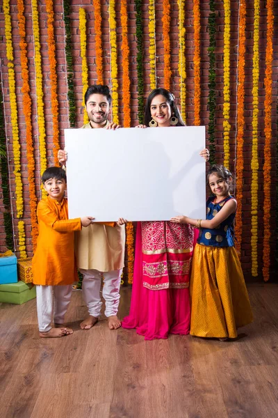 Indian Family Celebrating Diwali Festival While Holding Blank White Board — Stock Photo, Image