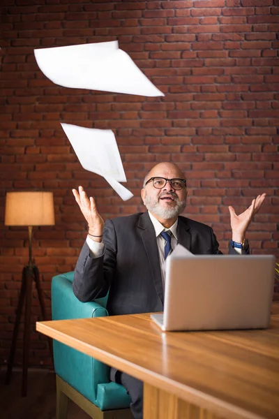 Portrait Indian Asian Senior Businessman Throwing Reading Documents While Sitting — Stock Photo, Image