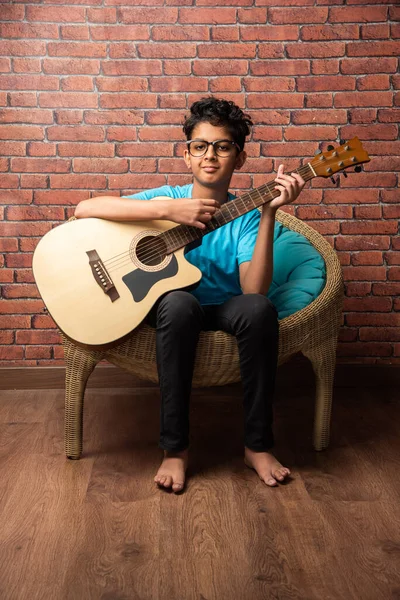 Indian Asian Boy Playing Acaustic Guitar While Sitting White Background — Stock Photo, Image