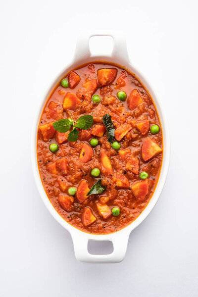 Carrot Curry or Garar Gravy sabzi made using tomato puree and spices, served in a bowl