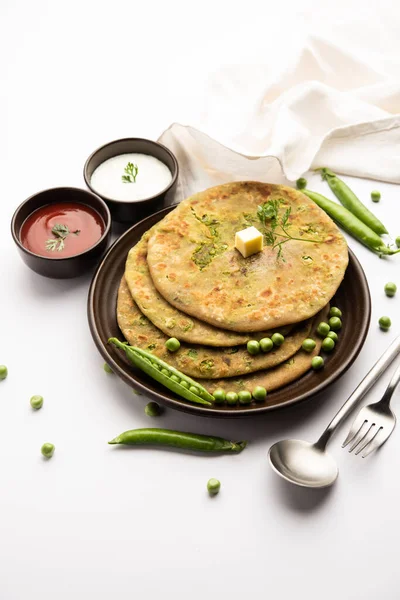 Green Peas or matar ka paratha is a Punjabi dish which is an Indian unleavened flatbread made with whole wheat flour, green peas. Served with ketchup and curd