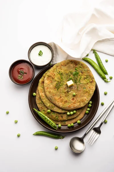 Green Peas or matar ka paratha is a Punjabi dish which is an Indian unleavened flatbread made with whole wheat flour, green peas. Served with ketchup and curd