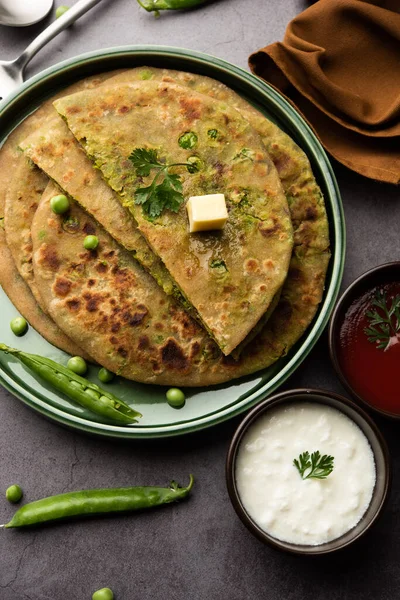 Green Peas or matar ka paratha is a Punjabi dish which is an Indian unleavened flatbread made with whole wheat flour, green peas. Served with ketchup and curd