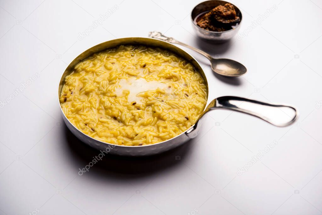Dal Khichdi Fry With Ghee served in a bowl. Tasty Indian one pot meal. selective focus