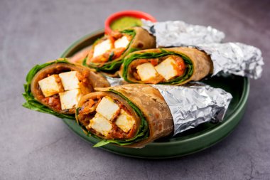 Cottage Cheese Paneer kathi roll or wrap also known as kolkata style spring rolls, vegetarians Indian food clipart