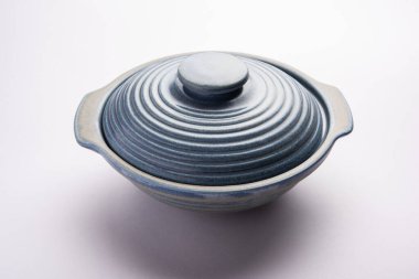 Blue empty ceramic bowl or container with lid, isolated over plain background