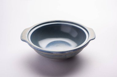 Blue empty ceramic bowl or container with lid, isolated over plain background