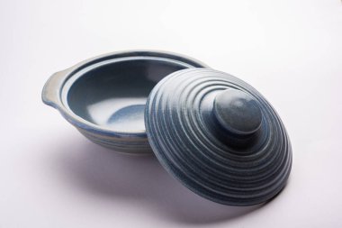 Blue empty ceramic bowl or container with lid, isolated over plain background