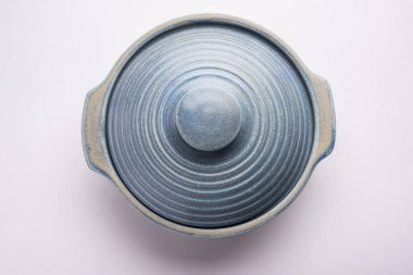 Blue empty ceramic bowl or container with lid, isolated over plain background