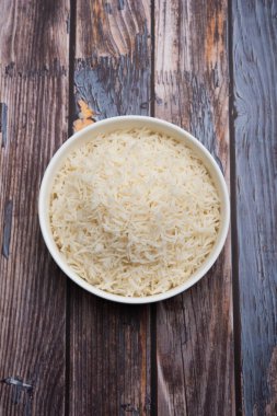 Aromatic Long Basmati cooked plain Rice is an Indian main course food, served in a bowl. selective focus