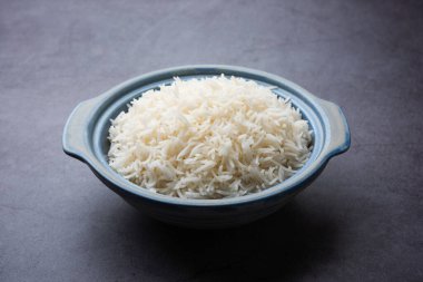 Aromatic Long Basmati cooked plain Rice is an Indian main course food, served in a bowl. selective focus