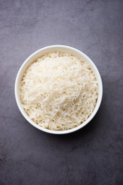 Aromatic Long Basmati cooked plain Rice is an Indian main course food, served in a bowl. selective focus