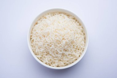 Aromatic Long Basmati cooked plain Rice is an Indian main course food, served in a bowl. selective focus