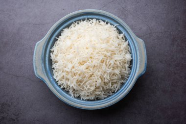 Aromatic Long Basmati cooked plain Rice is an Indian main course food, served in a bowl. selective focus