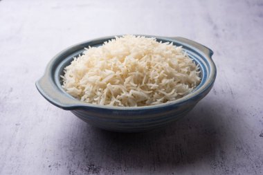 Aromatic Long Basmati cooked plain Rice is an Indian main course food, served in a bowl. selective focus