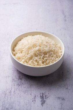 Aromatic Long Basmati cooked plain Rice is an Indian main course food, served in a bowl. selective focus