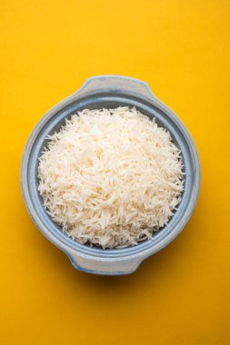 Aromatic Long Basmati cooked plain Rice is an Indian main course food, served in a bowl. selective focus