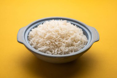Aromatic Long Basmati cooked plain Rice is an Indian main course food, served in a bowl. selective focus