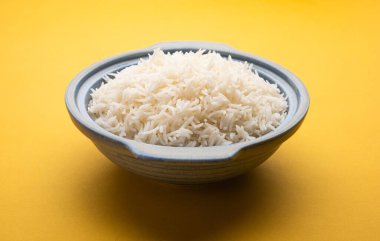 Aromatic Long Basmati cooked plain Rice is an Indian main course food, served in a bowl. selective focus