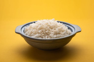 Aromatic Long Basmati cooked plain Rice is an Indian main course food, served in a bowl. selective focus