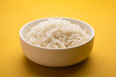 Aromatic Long Basmati cooked plain Rice is an Indian main course food, served in a bowl. selective focus