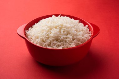Aromatic Long Basmati cooked plain Rice is an Indian main course food, served in a bowl. selective focus