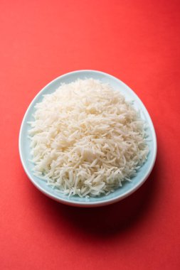 Aromatic Long Basmati cooked plain Rice is an Indian main course food, served in a bowl. selective focus
