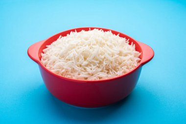 Aromatic Long Basmati cooked plain Rice is an Indian main course food, served in a bowl. selective focus
