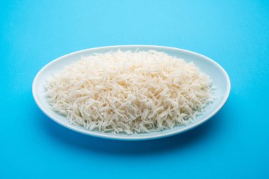 Aromatic Long Basmati cooked plain Rice is an Indian main course food, served in a bowl. selective focus