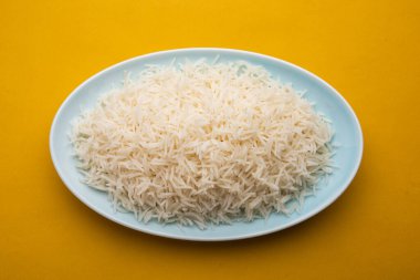 Aromatic Long Basmati cooked plain Rice is an Indian main course food, served in a bowl. selective focus