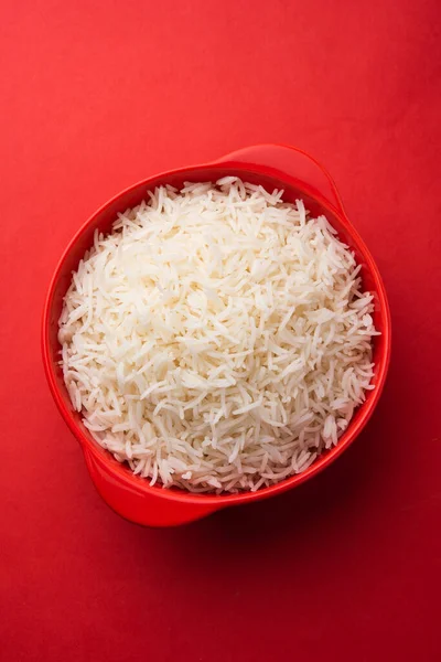 Aromatic Long Basmati cooked plain Rice is an Indian main course food, served in a bowl. selective focus