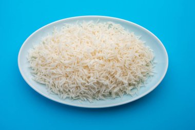 Aromatic Long Basmati cooked plain Rice is an Indian main course food, served in a bowl. selective focus