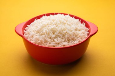 Aromatic Long Basmati cooked plain Rice is an Indian main course food, served in a bowl. selective focus