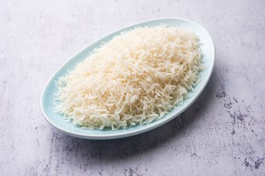 Aromatic Long Basmati cooked plain Rice is an Indian main course food, served in a bowl. selective focus