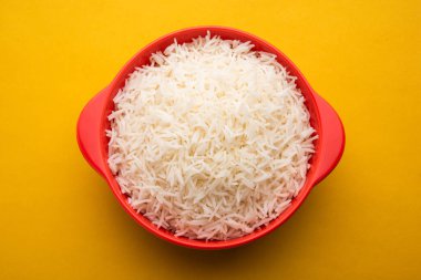 Aromatic Long Basmati cooked plain Rice is an Indian main course food, served in a bowl. selective focus