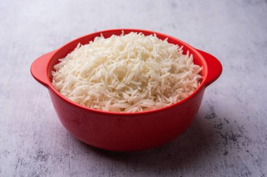 Aromatic Long Basmati cooked plain Rice is an Indian main course food, served in a bowl. selective focus