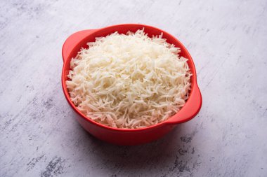 Aromatic Long Basmati cooked plain Rice is an Indian main course food, served in a bowl. selective focus