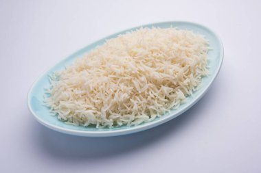 Aromatic Long Basmati cooked plain Rice is an Indian main course food, served in a bowl. selective focus