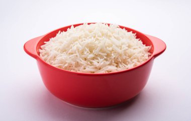 Aromatic Long Basmati cooked plain Rice is an Indian main course food, served in a bowl. selective focus