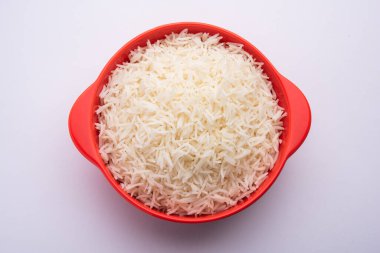 Aromatic Long Basmati cooked plain Rice is an Indian main course food, served in a bowl. selective focus