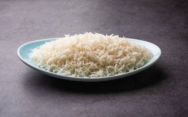 Aromatic Long Basmati cooked plain Rice is an Indian main course food, served in a bowl. selective focus
