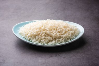 Aromatic Long Basmati cooked plain Rice is an Indian main course food, served in a bowl. selective focus